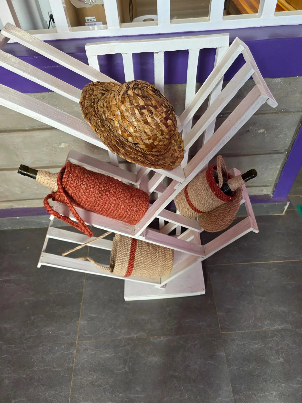 Banana fibre bottle sleeves, a woven hat and a wine rack made at Bansoko Centre
